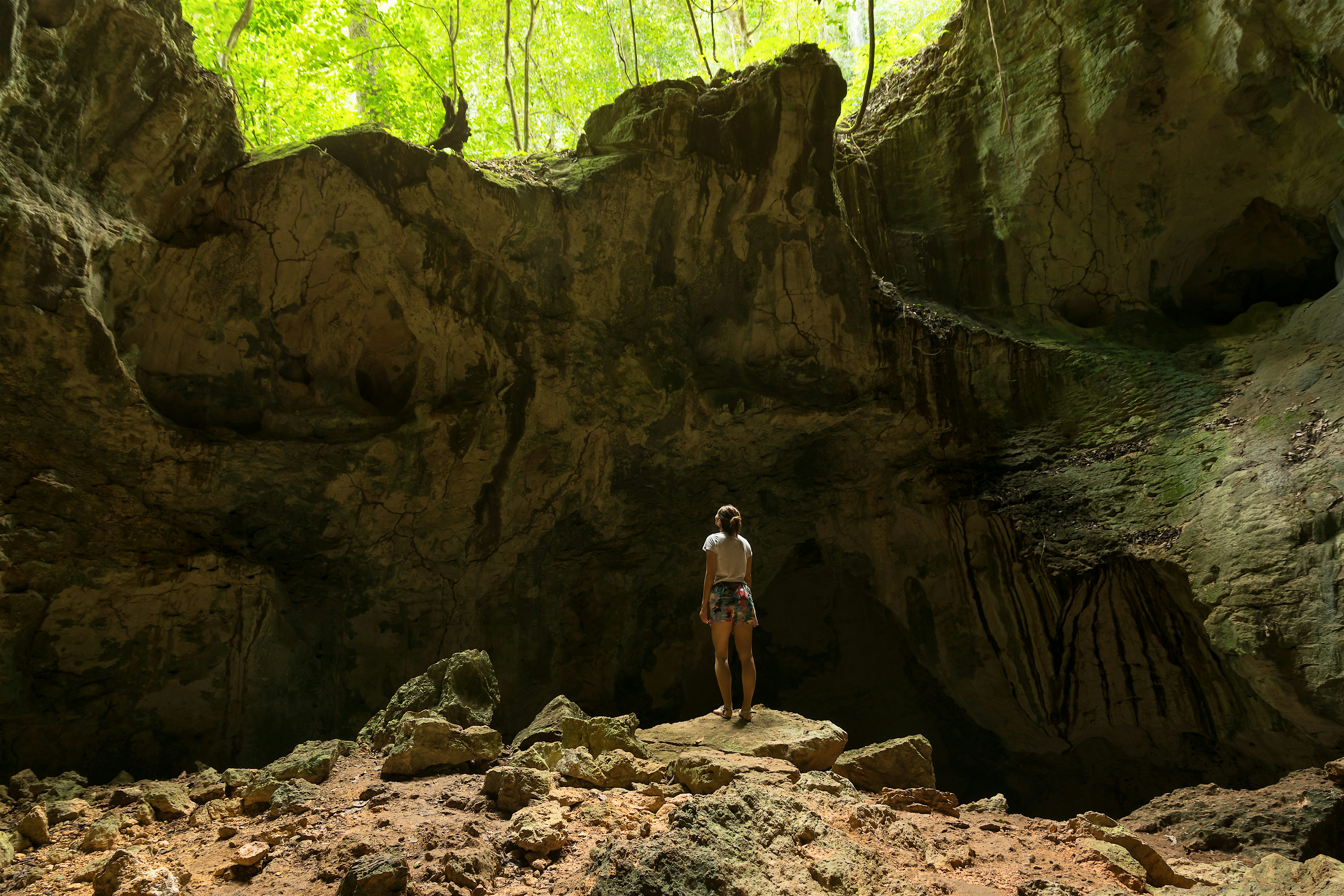 Los Haitises National Park person standing inside Line Cave