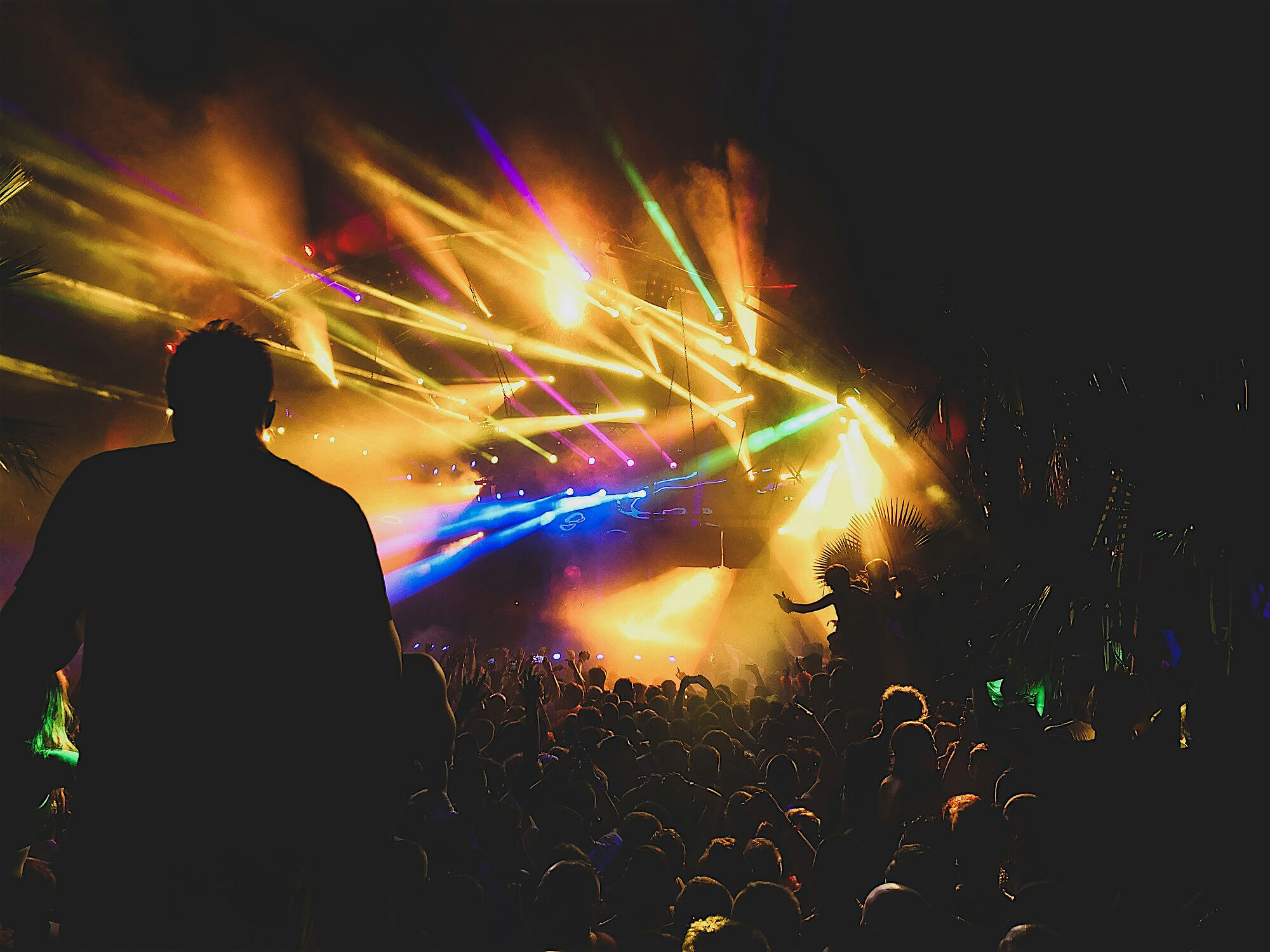 Club. Crowd of people dancing in the dark lit up with bright strobe lights