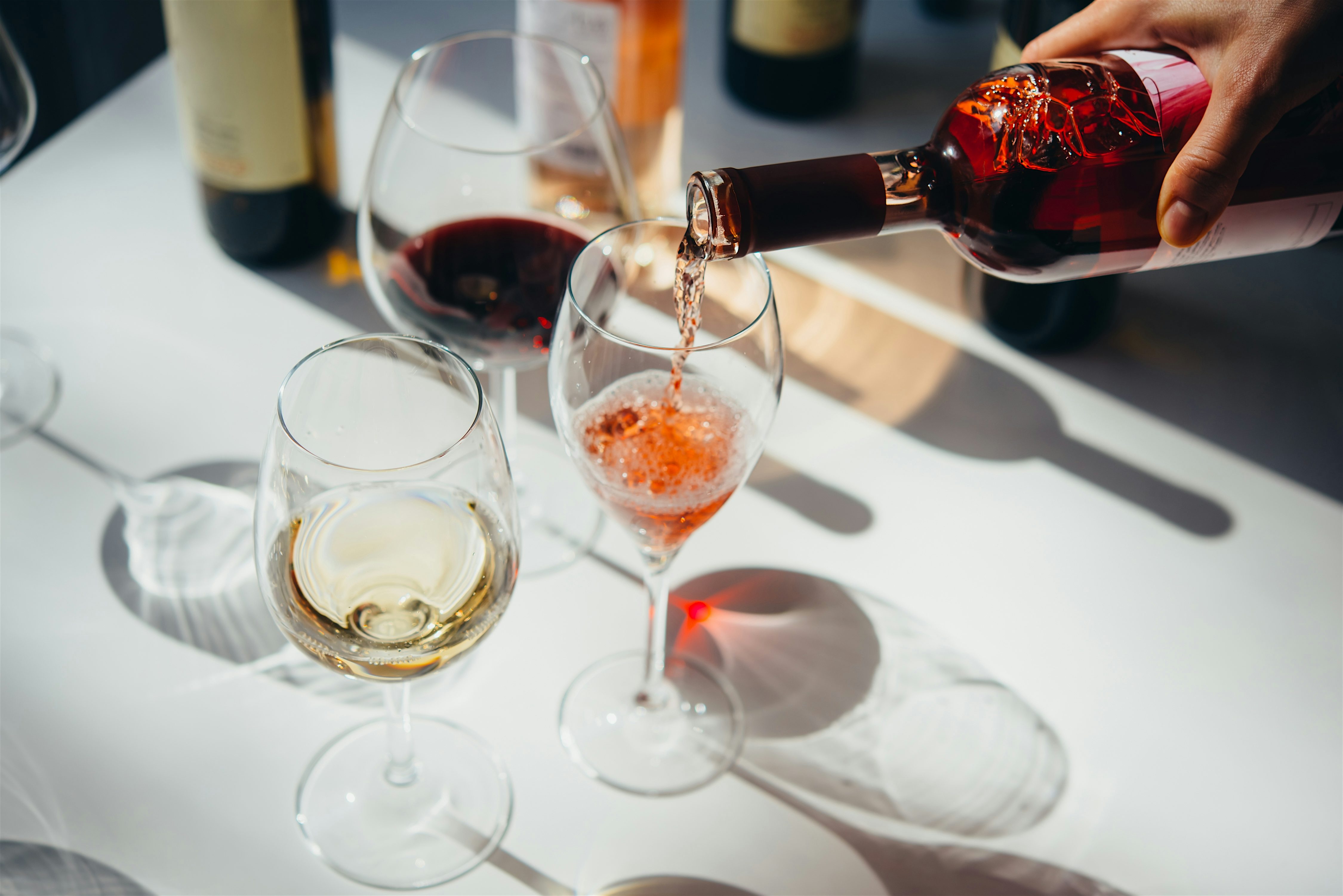 Glasses of wine being poured