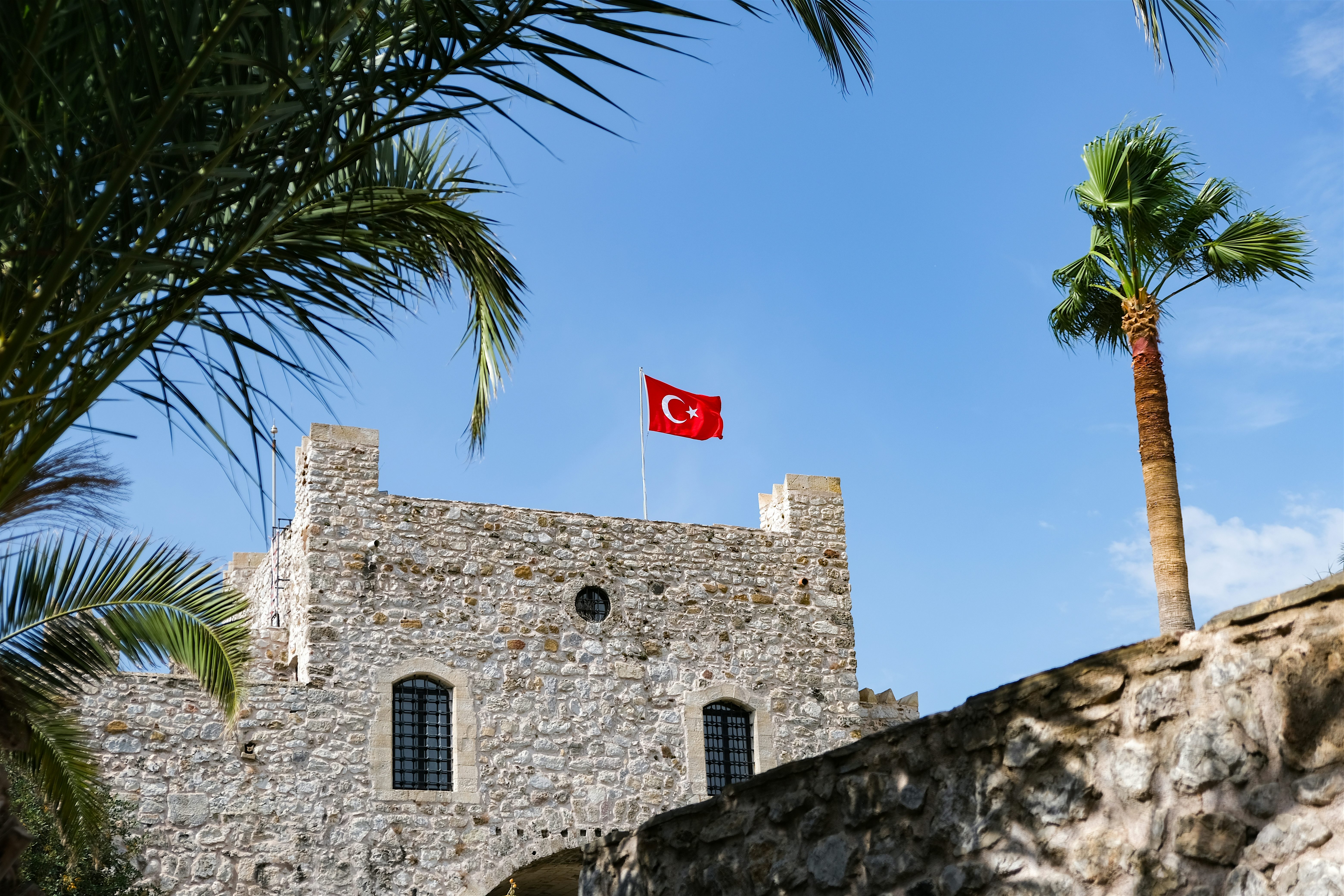 Marmaris Castle with palm trees on the sides