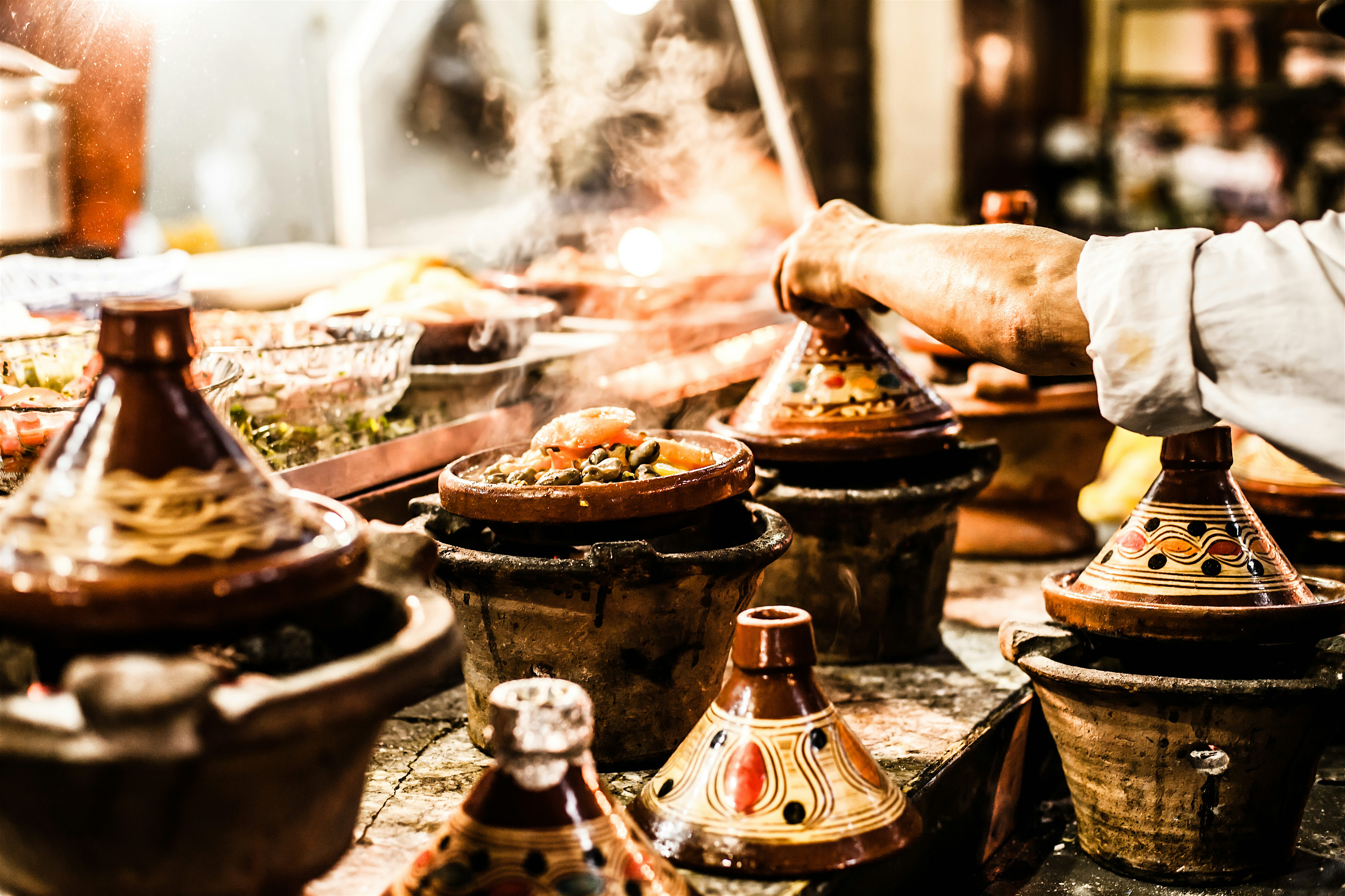 Traditional food being cooked in tagines