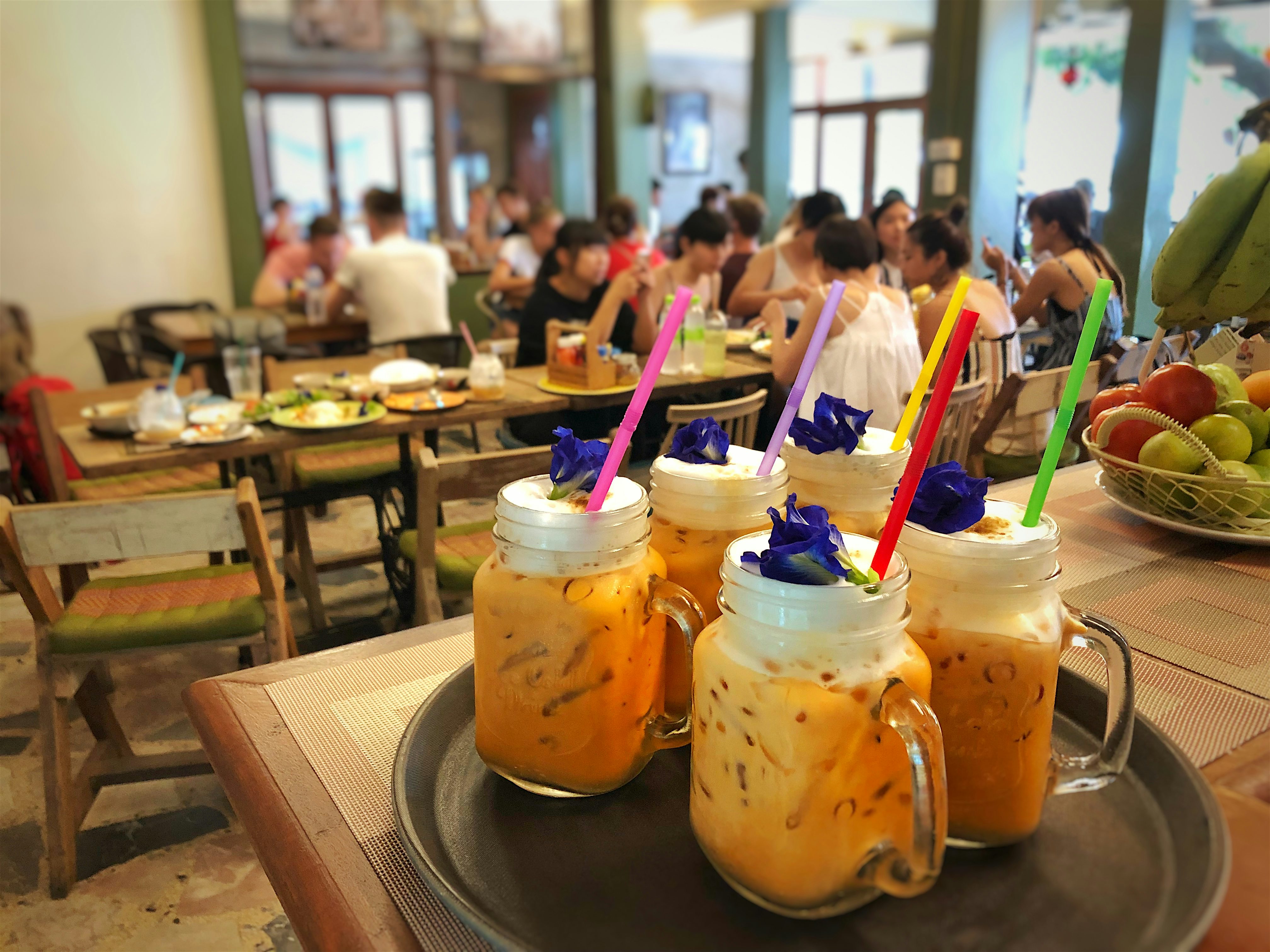 Tray of decorative iced tea drinks on top of the bar