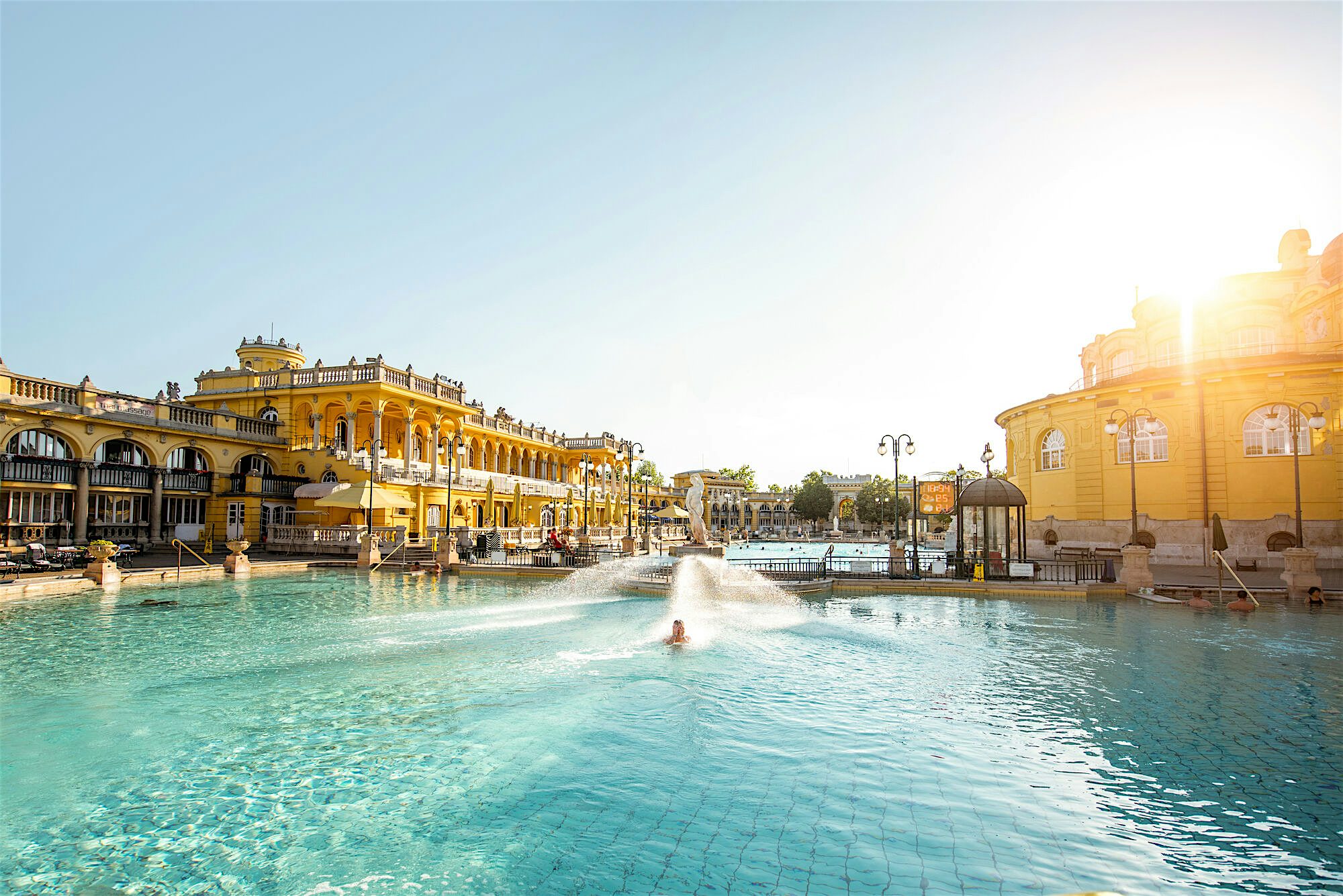 Large outdoor thermal pool with pale blue water