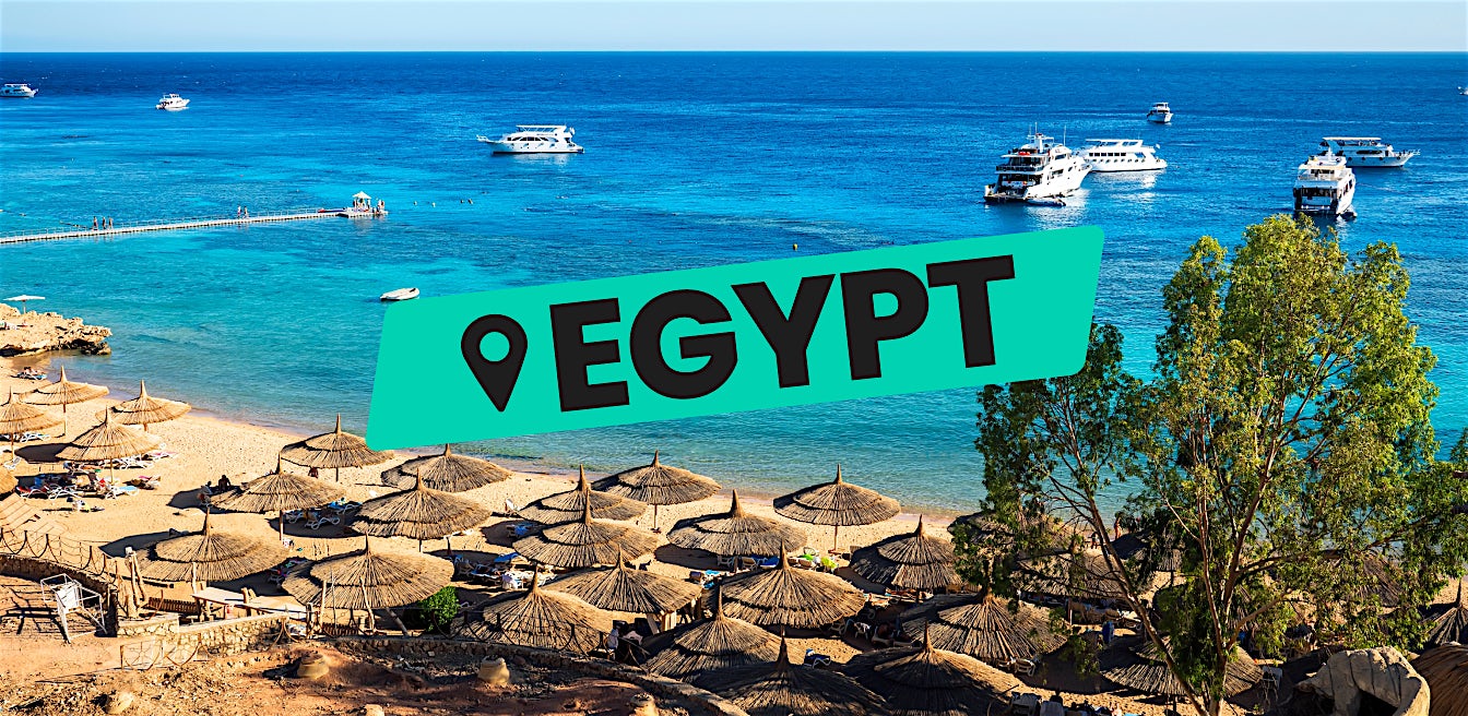 Egypt all inclusive beach holiday with resort umbrellas and clear blue sea