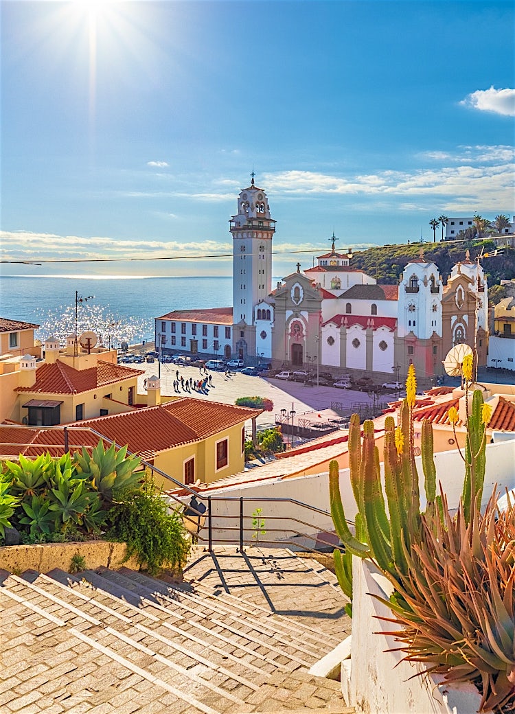 Tenerife coastal town with historic church, colourful buildings, ocean views and traditional Canary Islands architecture.