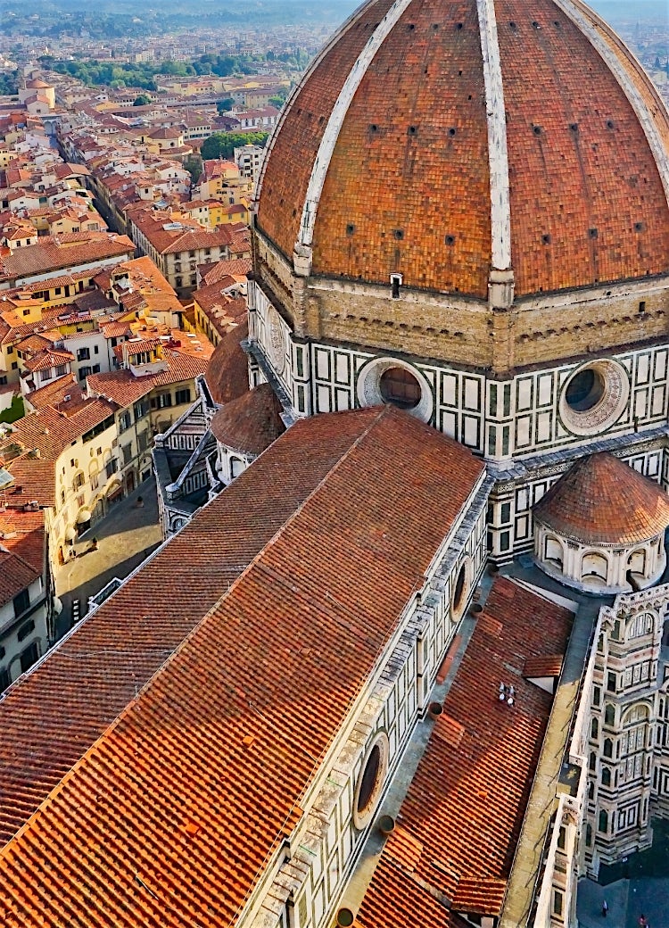 Aerial view of Florence Cathedral’s Duomo, Italy, overlooking Florence’s historic terracotta rooftops and Renaissance cityscape.