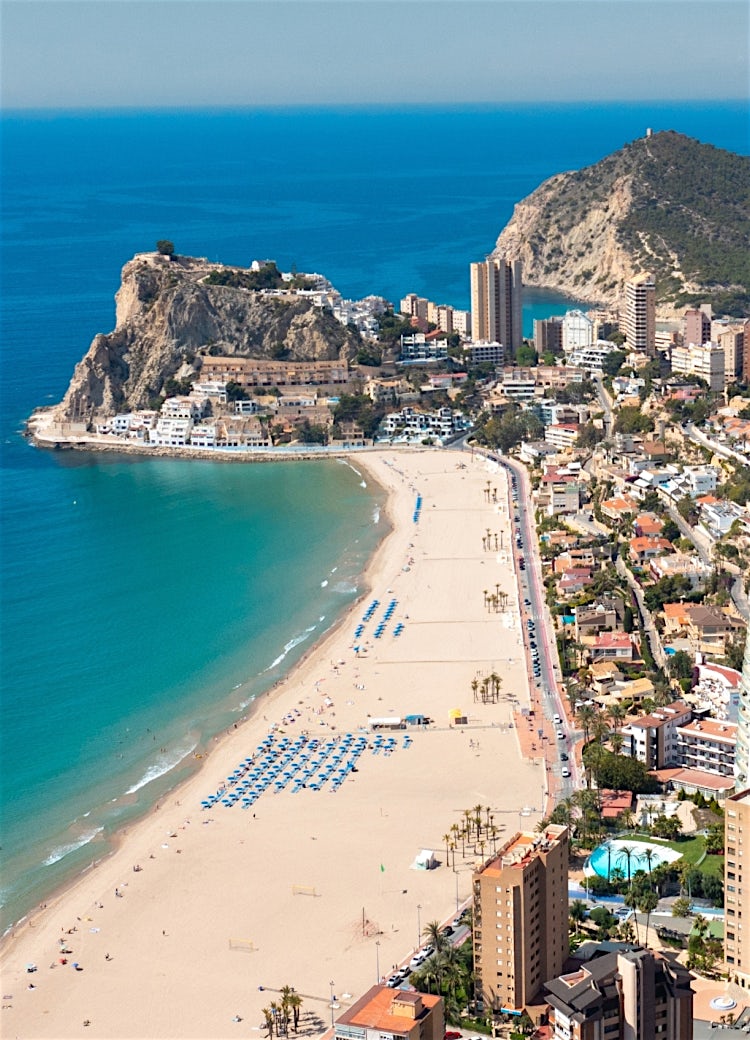 Aerial view of Benidorm coastline, golden beach, Mediterranean Sea and skyline on Costa Blanca, Spain.