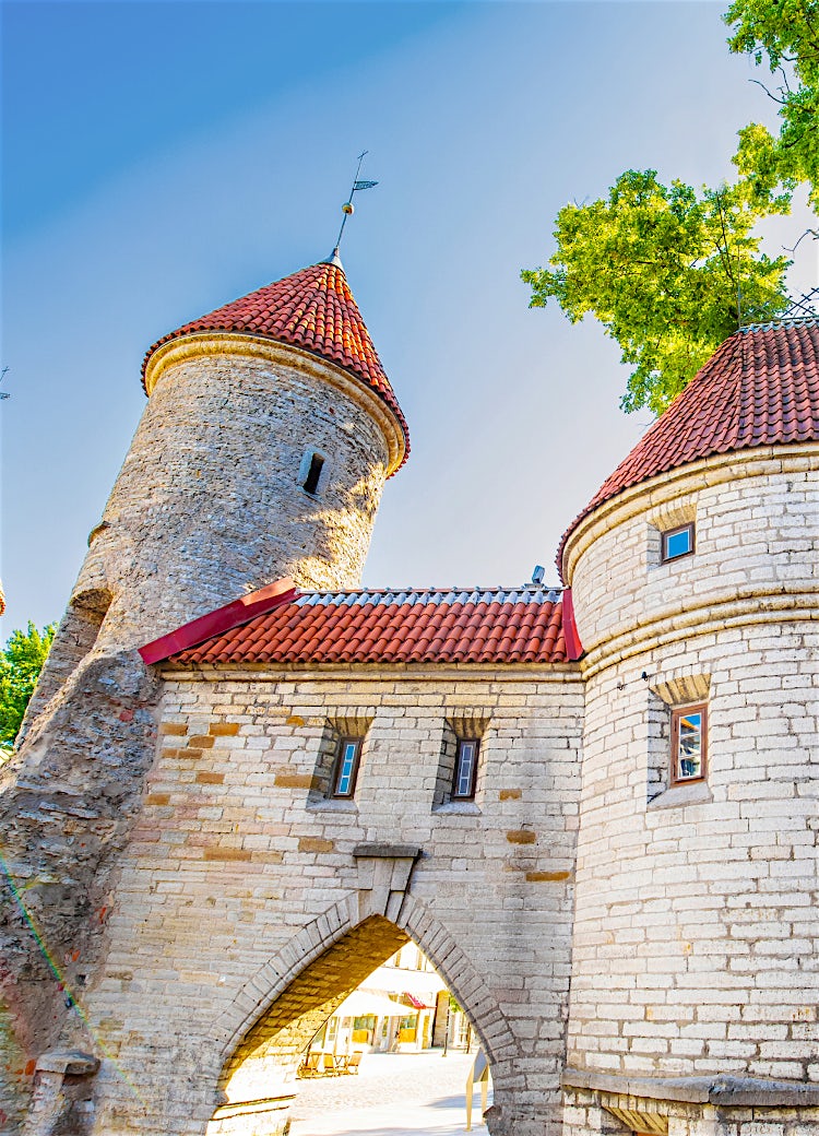Tallinn Old Town medieval stone towers and historic city walls with red-tiled roofs in Estonia.