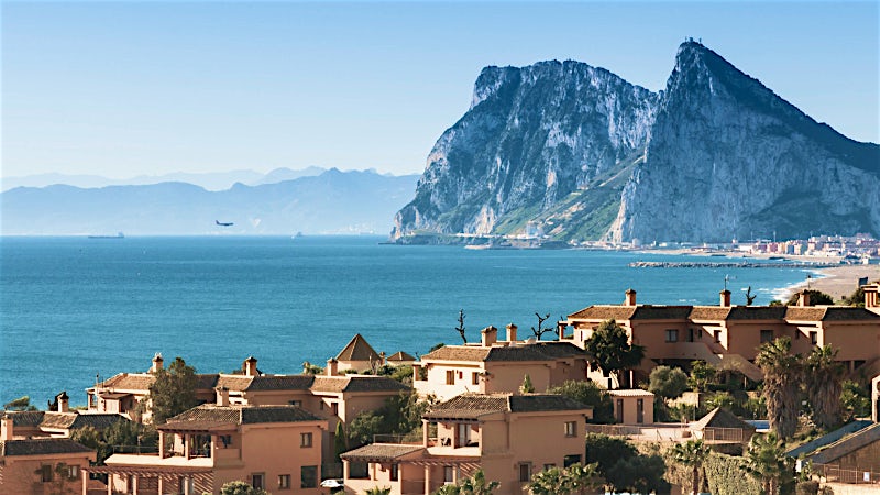 Costa del Sol coastline with the Rock of Gibraltar, Mediterranean Sea views, beachfront homes and dramatic coastal landscape.