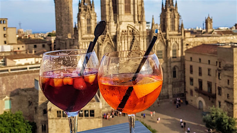 Barcelona rooftop cocktails overlooking Gothic Quarter cathedral, featuring sangria and aperitif drinks with historic city views.