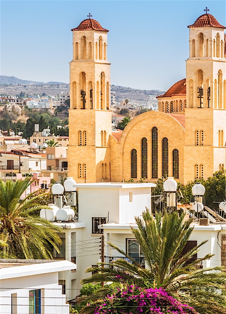 Paphos cathedral overlooking the city, featuring twin bell towers, Byzantine architecture and panoramic Cyprus town views.