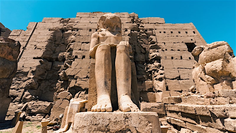 Luxor Egypt ancient temple statue at historic archaeological site and iconic pharaonic landmark