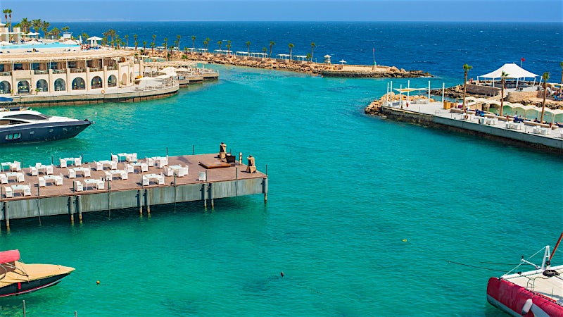 Hurghada Egypt marina with turquoise Red Sea waters, luxury yachts and waterfront resort views