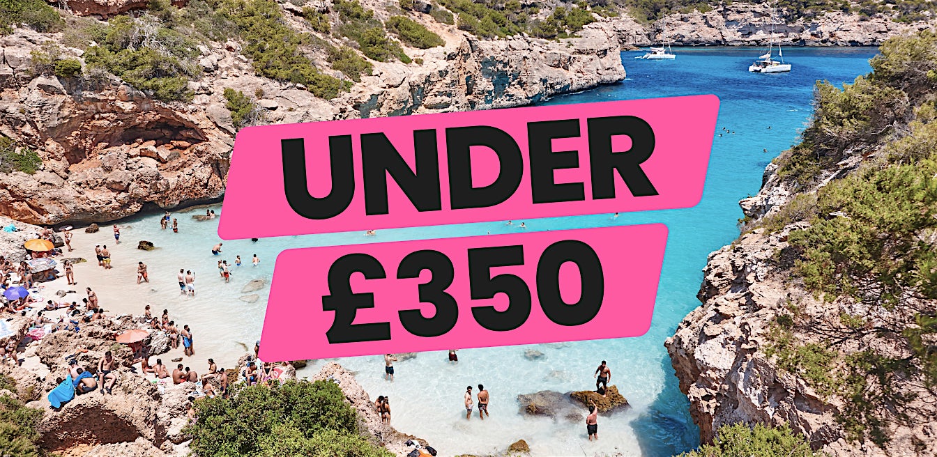 Beautiful Mediterranean-style beach cove with clear waters and sunshine, ideal for cheap holidays under £350 and budget breaks by Sundeals.