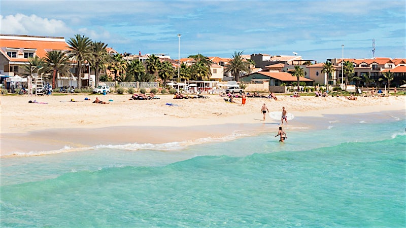 Santa Maria Beach with turquoise water, golden sand and seafront resort area, Sal, Cape Verde.