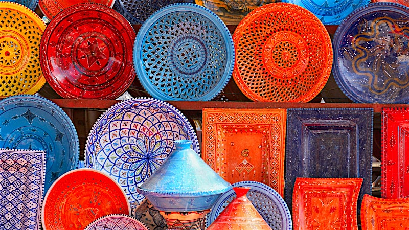 Traditional Tunisian pottery and colourful handcrafted ceramics market display, Skanes, Tunisia.