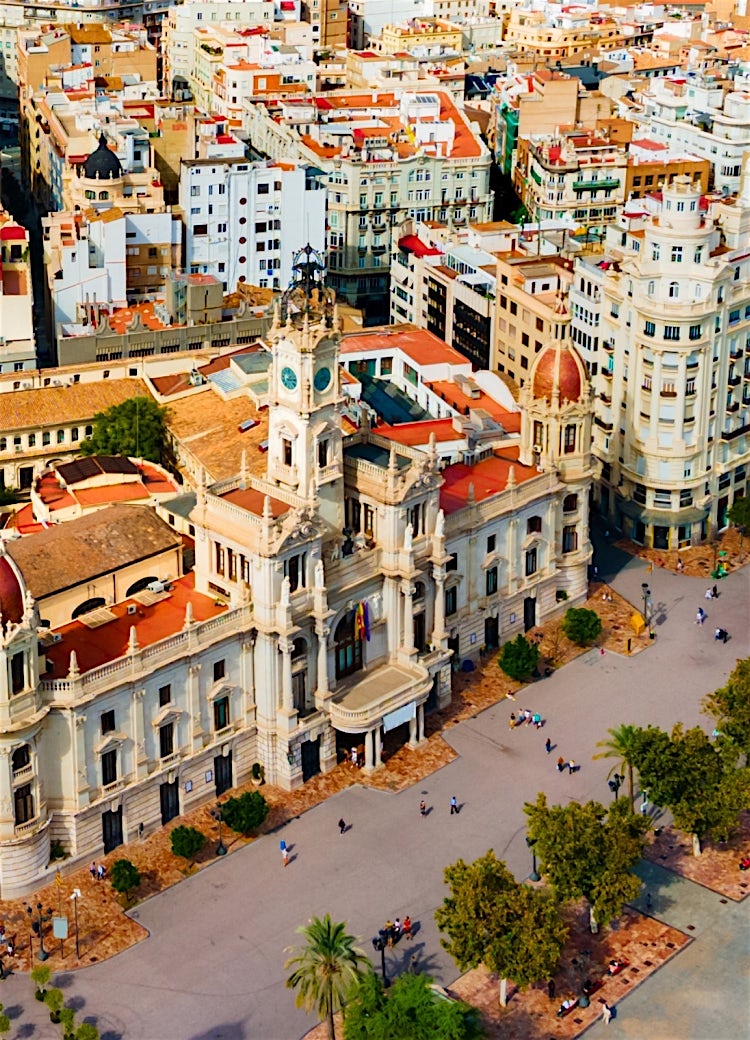 Valencia city centre aerial view featuring Plaza del Ayuntamiento, historic architecture, bustling streets and vibrant urban skyline.