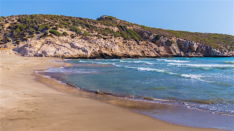 Patara Beach Turkey with golden sand, turquoise sea and rugged Mediterranean coastline