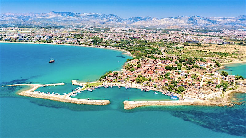 Side Turkey harbour with turquoise bay, marina and coastal town aerial view