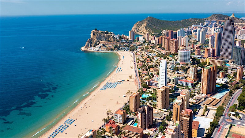 Benidorm Spain beachfront skyline with high-rise hotels, sandy beach and Mediterranean coastline