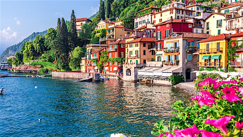 Lake Como Italy waterfront village with colourful houses, lakeside views and mountain scenery
