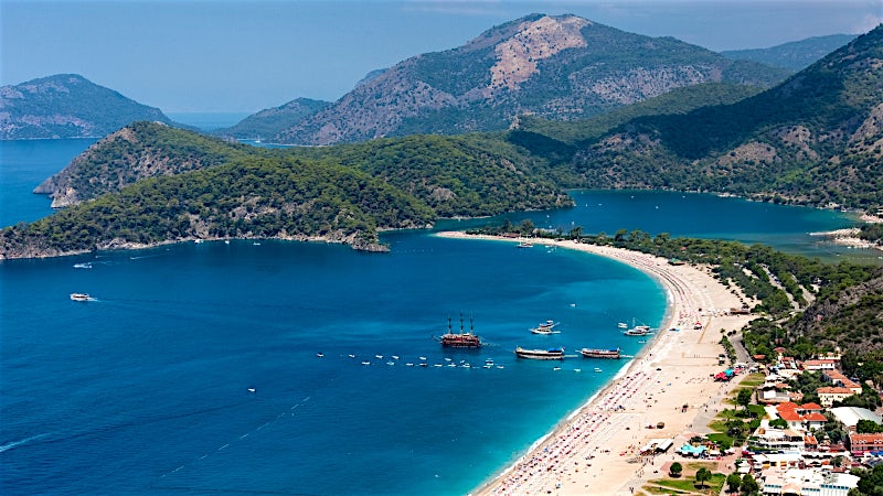 Oludeniz Turkey Blue Lagoon with turquoise waters, sandy beach and mountain coastline