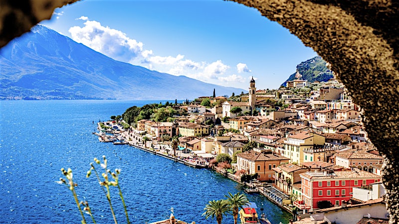 Lake Garda Italy lakeside town with mountain views, waterfront promenade and historic architecture