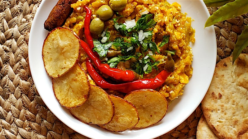 Traditional Tunisian kefteji dish with vegetables, eggs, potatoes and chilli peppers.