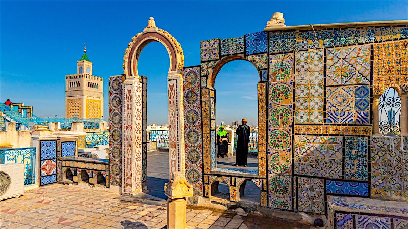 Colourful mosaic architecture and traditional Islamic design at a historic Tunisian landmark.