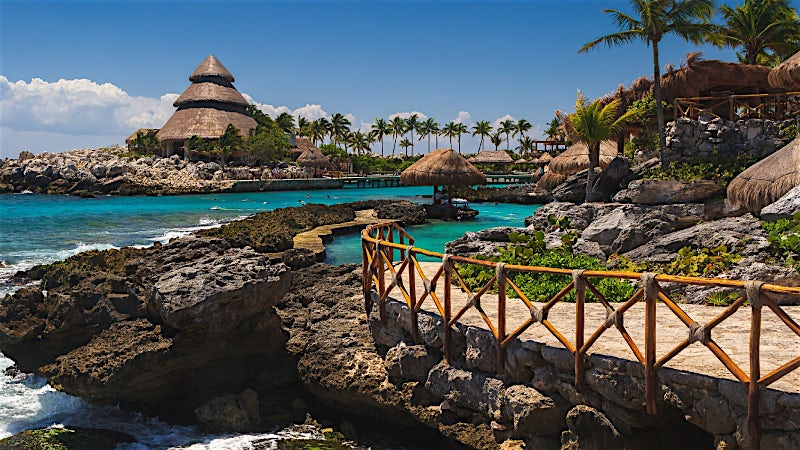 Xcaret Park coastline with turquoise waters, tropical scenery and eco-park attractions in Mexico.
