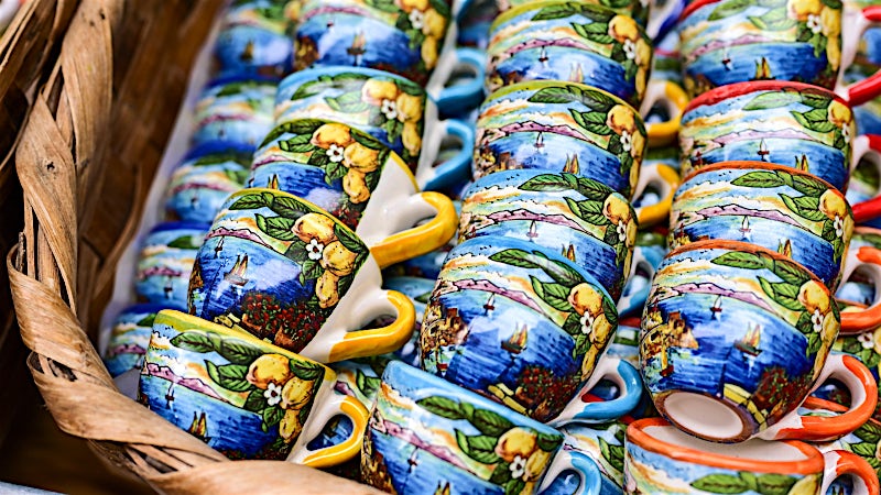 Colourful hand-painted ceramic cups and traditional Italian pottery, Amalfi Coast, Italy.