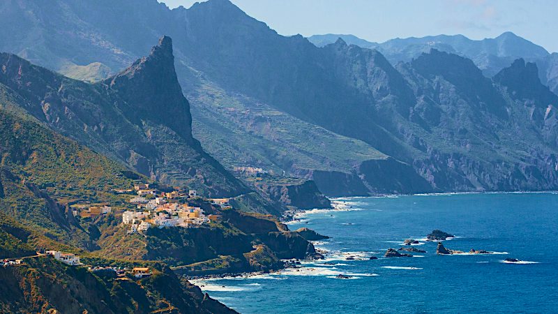 Rugged volcanic coastline meets the Atlantic beneath dramatic Tenerife mountains, perfect for scenic Value holidays.